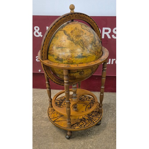 25 - An Italian terrestrial globe cocktail cabinet/trolley