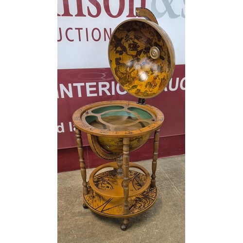 25 - An Italian terrestrial globe cocktail cabinet/trolley