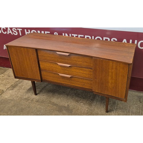 28 - An Austin Suite teak concave sideboard