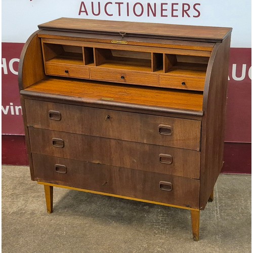 34 - A Swedish S.M.I. teak cylinder bureau, designed by Egon Ostergaard