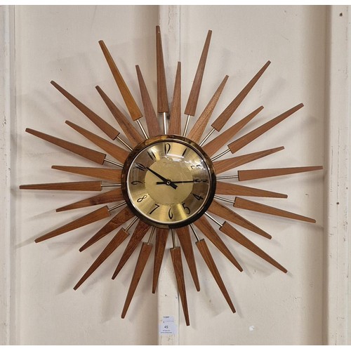 45 - An Anstey & Wilson teak sunburst wall clock