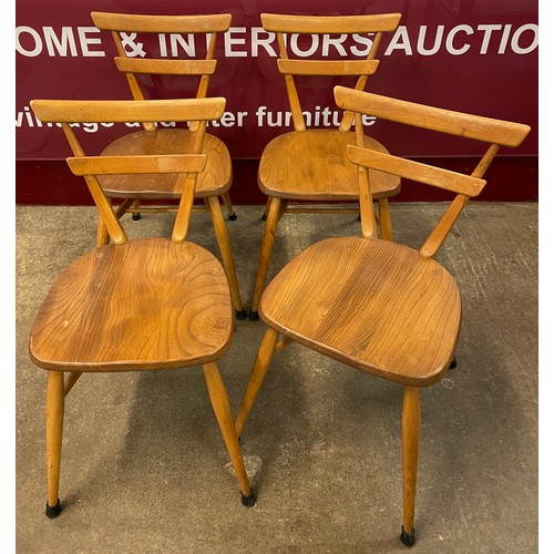 41 - A set of four Ercol Blonde elm and beech adult green dot stacking chairs