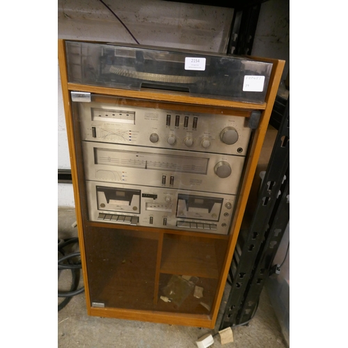 2128 - Am Amstrad stereo music system with cabinet including an electronic belt driven turntable record pla... 