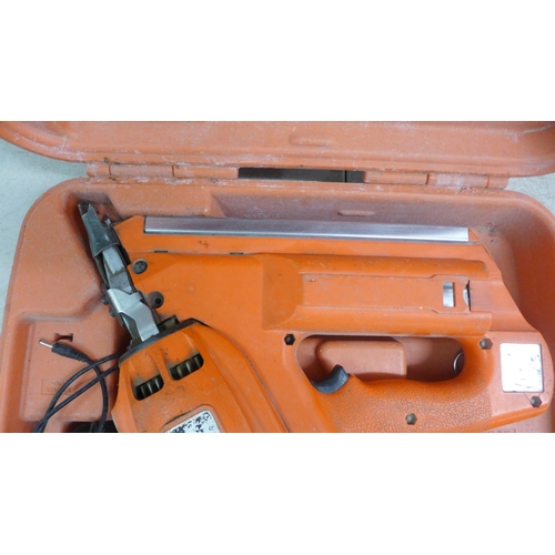 2002 - A Paslode Impulse utility framing nailer in case with battery and charger