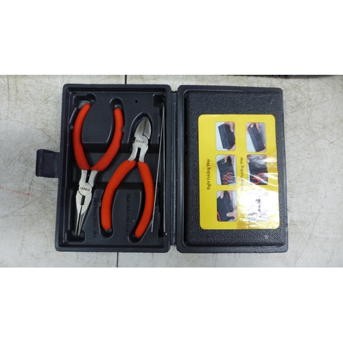 2019 - A plastic toolbox with a Black and Decker Scorpion KS890GT hand saw, a Workzone electrical repair ki... 