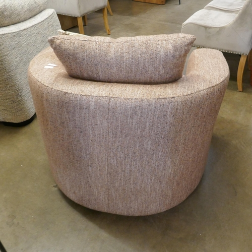 1340 - A brick upholstered swivel armchair, brand new