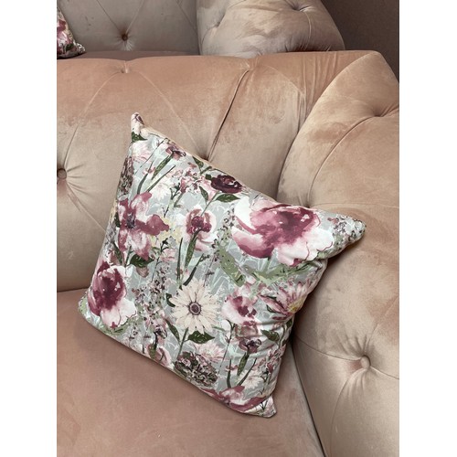 1455 - A pink velvet cuddle chair, brand new RRP £919