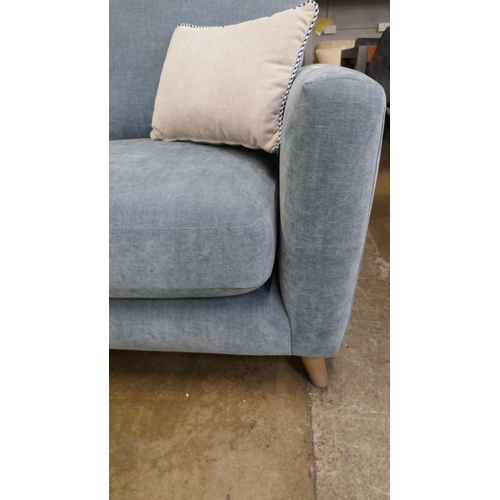 1472 - A blue velvet three seater sofa, brand new