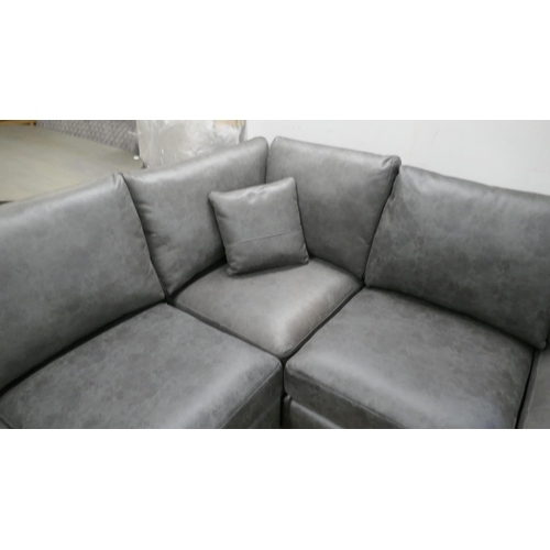 1393 - A charcoal Alcantara corner sofa and footstool, brand new, very slight colour variation to cushion c... 