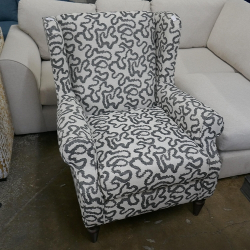 1413 - A charcoal patterned wingback armchair, brand new