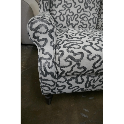 1413 - A charcoal patterned wingback armchair, brand new