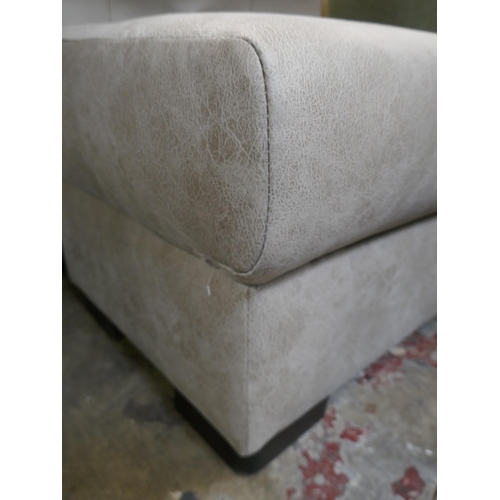 1419 - A stone Alcantara footstool, brand new