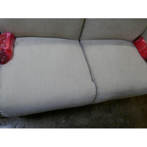 1423 - An ivory textured velvet electric reclining two seater sofa, brand new