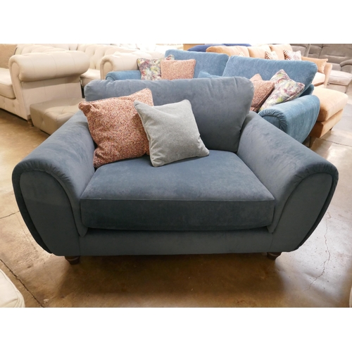 1428 - A petrol blue velvet two seater sofa with contrasting scatter cushions, brand new