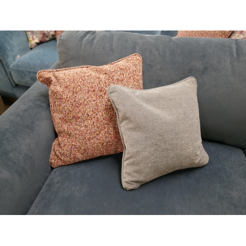 1428 - A petrol blue velvet two seater sofa with contrasting scatter cushions, brand new