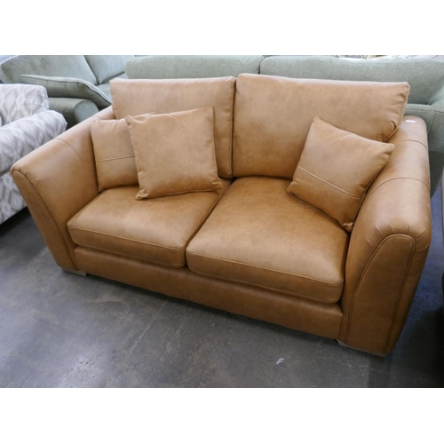 1452 - A tan Alcantara three seater sofa, brand new RRP £749