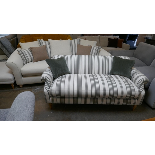 1463 - A calico three seater sofa with contrasting scatter cushions and a calico and olive three seater sof... 