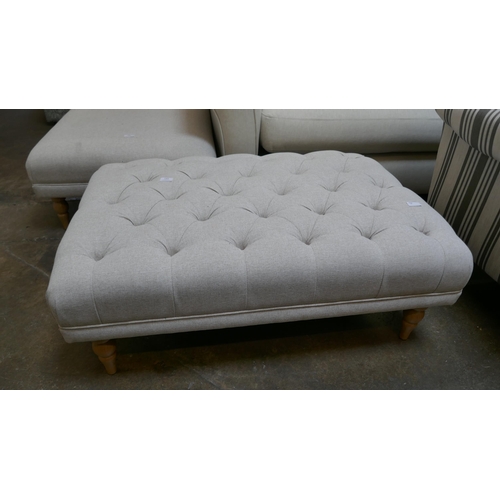 1464 - A calico buttoned footstool, brand new