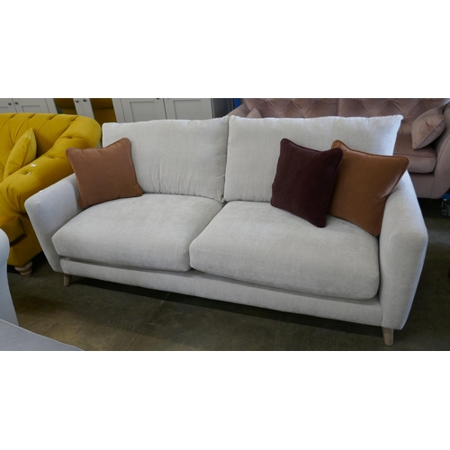 1487 - A grey velvet three seater sofa, brand new RRP £1019