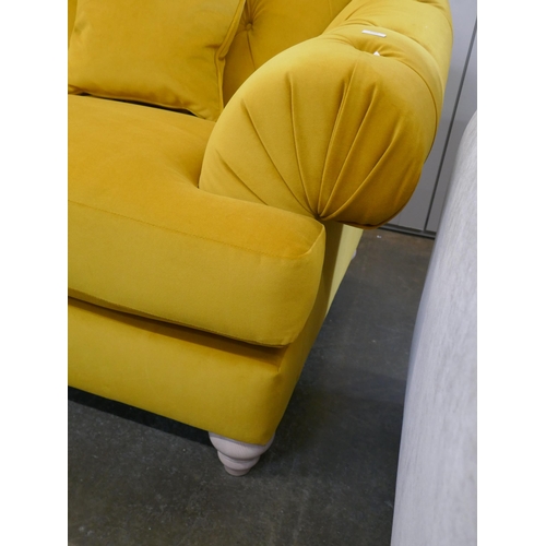 1488 - A gold velvet buttoned three seater sofa, brand new RRP £1399