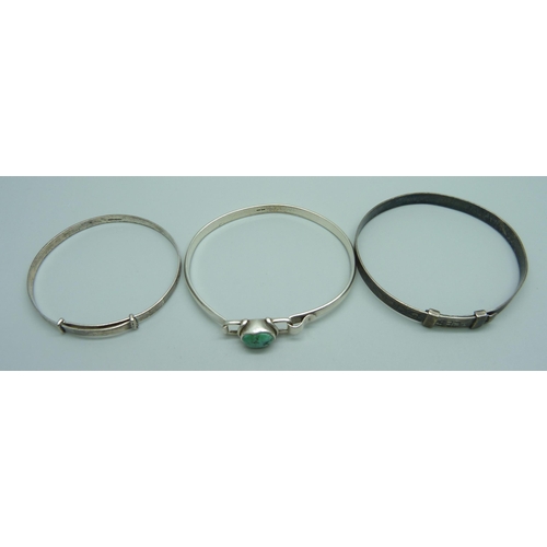 1000 - Three silver bangles, 27g