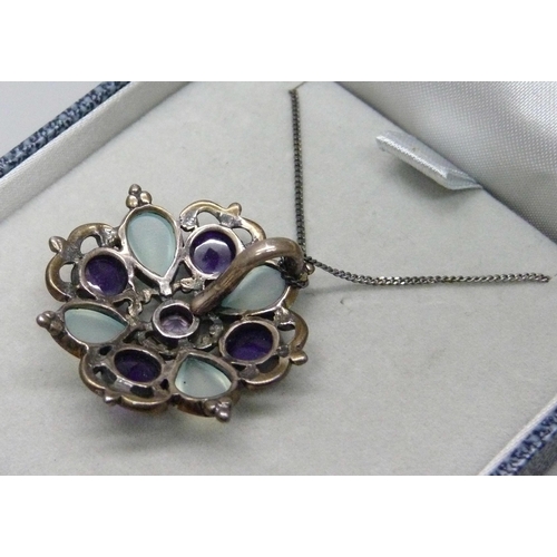 1003 - A silver, moonstone and amethyst pendant and chain