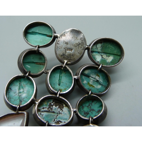 1009 - A large turquoise and stone set silver bracelet, 6.5cm wide, (three connections require weld repair)