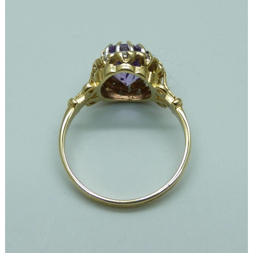 1014 - A 9ct gold amethyst and diamond cluster ring, 3.7g, S