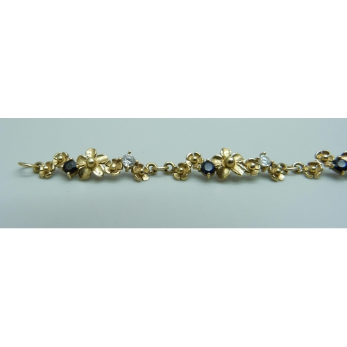 1020 - A 9ct gold sapphire and zircon bracelet, 6.8g, 18cm