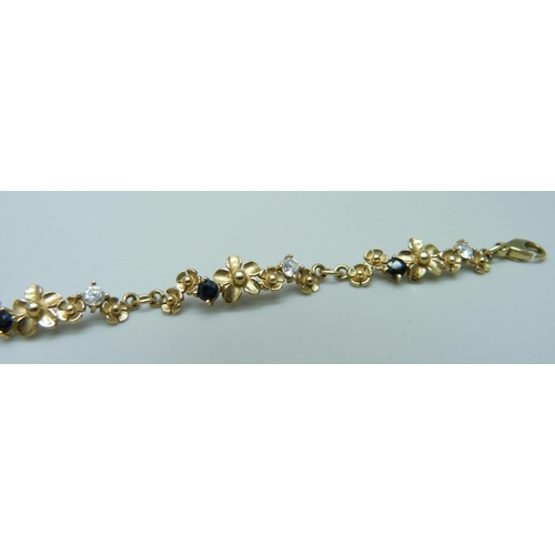 1020 - A 9ct gold sapphire and zircon bracelet, 6.8g, 18cm