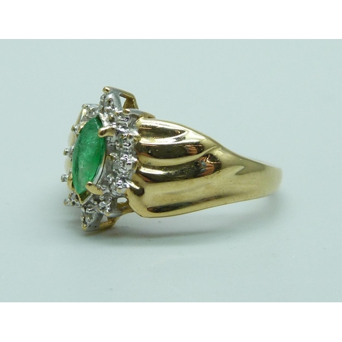 1027 - A 10k gold emerald and diamond ring, 3.4g, N