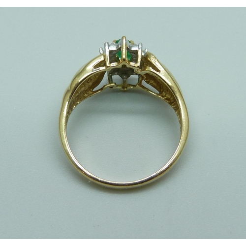 1027 - A 10k gold emerald and diamond ring, 3.4g, N