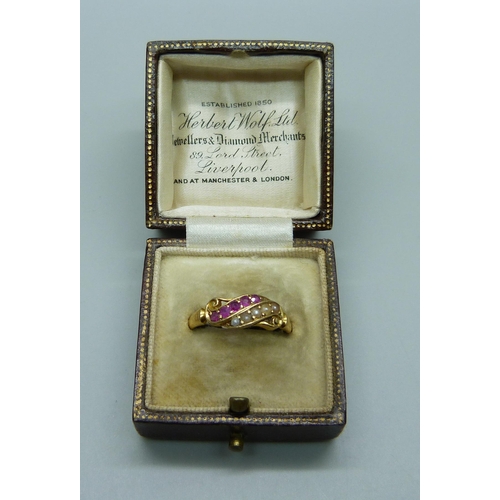 1030 - An 18ct gold ruby and pearl ring, with inscription dated 1900, 3.2g, Q, in a vintage box