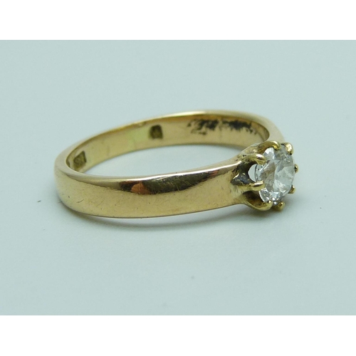 1034 - An 18ct gold diamond solitaire ring, approximately 0.30ct diamond weight, 3.4g, M