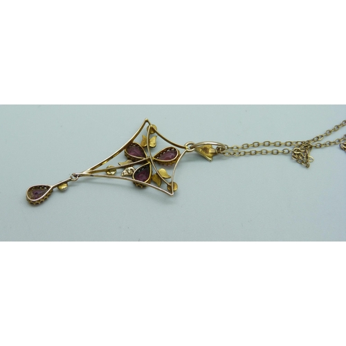 1043 - A almandine garnet and seed pearl pendant on a fine 9ct gold chain, total weight 3g, chain 44cm