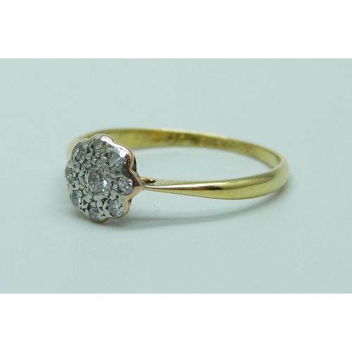 1044 - An 18ct gold, platinum set diamond cluster ring, 1.6g, O