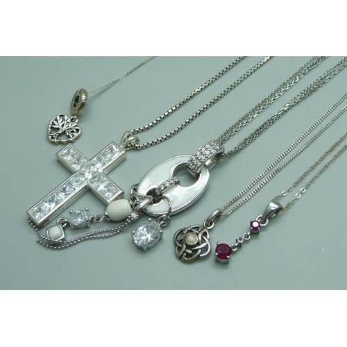 1048 - Five silver pendants and chains, 35g