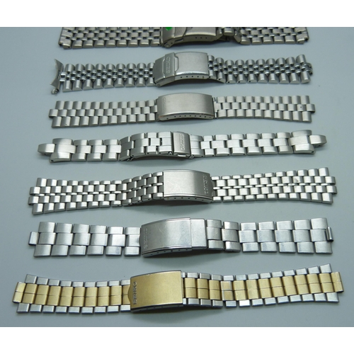 1052 - Seven Seiko wristwatch bracelets and a strap, (one lacking end piece)