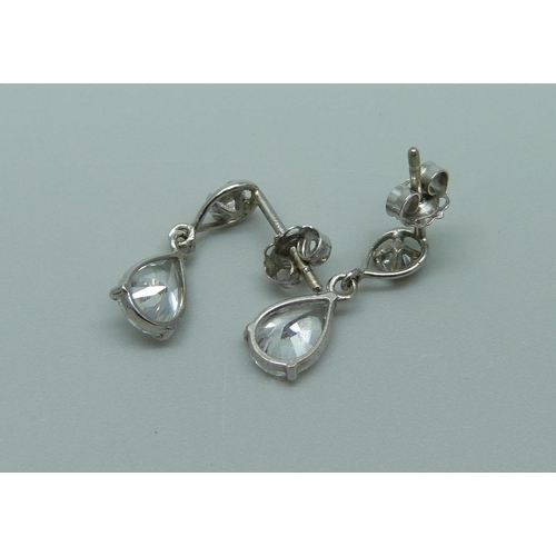 1055 - A pair of 9ct white gold diamond and crystal drop earrings, 1.1g