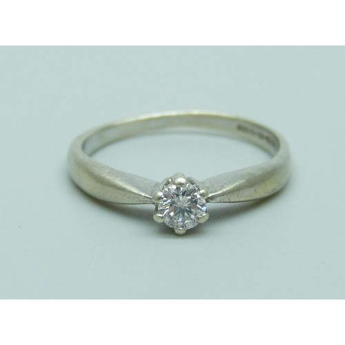 1065 - A 9ct white gold and diamond solitaire ring, 1.8g, L