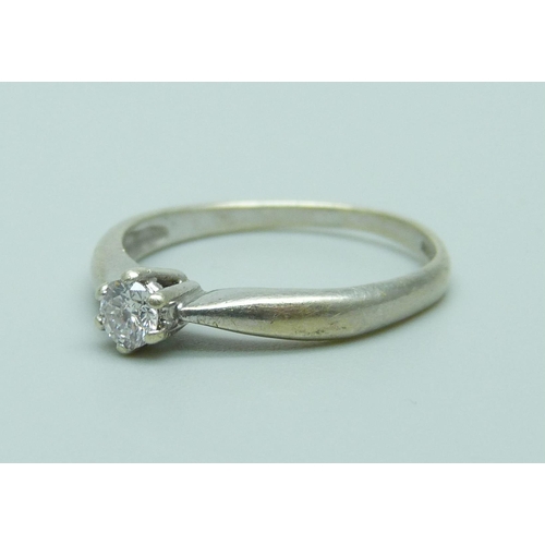 1065 - A 9ct white gold and diamond solitaire ring, 1.8g, L