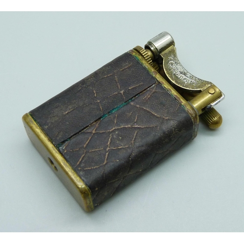 1069 - A vintage Mulberry Casanova lighter with leather overlay, with logo impression