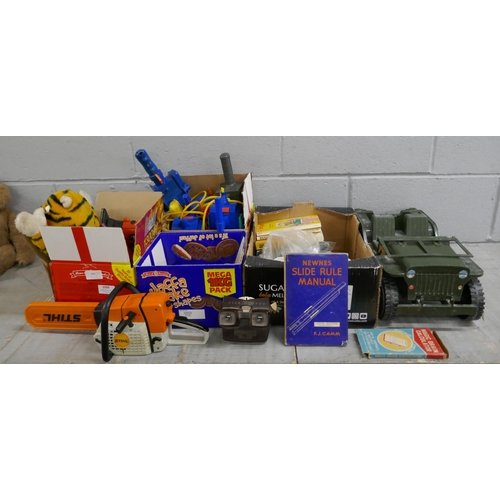 1098 - A collection of toys, including Ghostbusters, Action Man jeep, toy Stihl chainsaw and sander, Bakeli... 