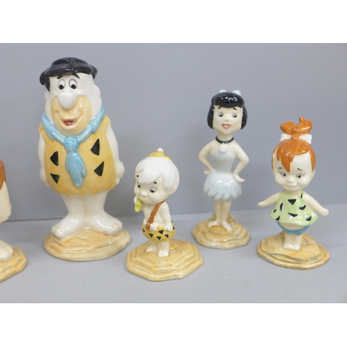 606 - Six Beswick Fred Flintstone figures, five boxed