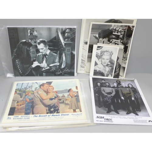 611 - A collection of lobby cards and celebrity photographs including Abbott & Costello, Elvis Presley, Da... 