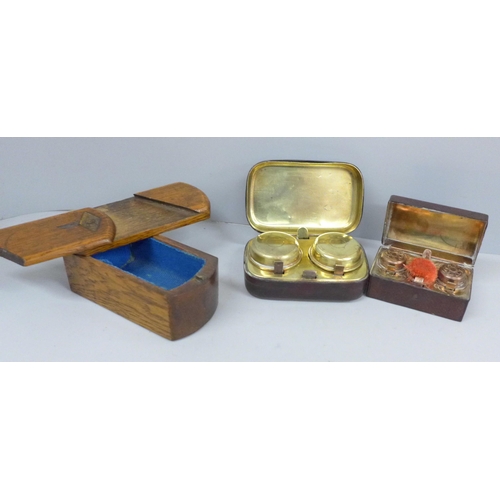 634 - Two cased travel inkwells and a wooden puzzle box