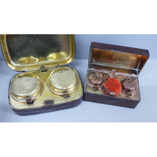 634 - Two cased travel inkwells and a wooden puzzle box