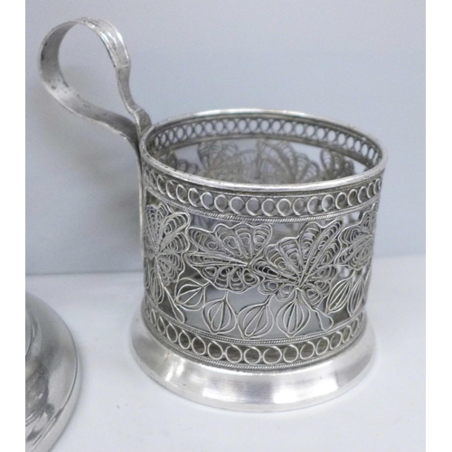 635 - An Art Nouveau style pewter chamber candle holder by Thomas Williams and a silver plated Russian cup... 