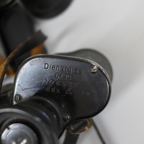 647 - A pair of German Dienstglas 7x50 binoculars no. 406925 and one other pair of Dienstglas 6x30 binocul... 