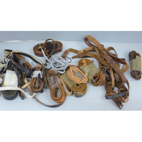 648 - A collection of vintage binocular and binocular case straps and a Lieberman & Gortz catalogue